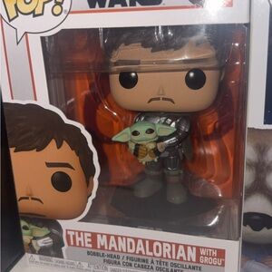 Funko Pop! The Mandalorian Holding Grogu with Green and Tan Details